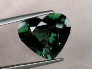 14.25 carats heart shape green sapphire nicely cut and perfectly clean. 