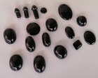 Tektite cabochons and religious penis carvings from the Tonlé Sap meteorite impact in Cambodia. 